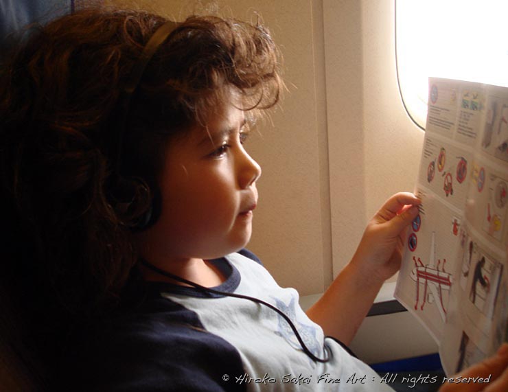 little girl, little girl reading the emergency instruction at airplane window, airplane, trip, kid, child, beautiful little girl, adventure