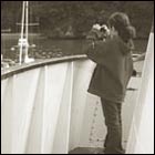 little photographer, girl taking picture from the deck of ferry