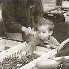 little boy getting a scoop of blue berries, fruit, harvest, farmer's market, holiday, food, family, mother and baby 